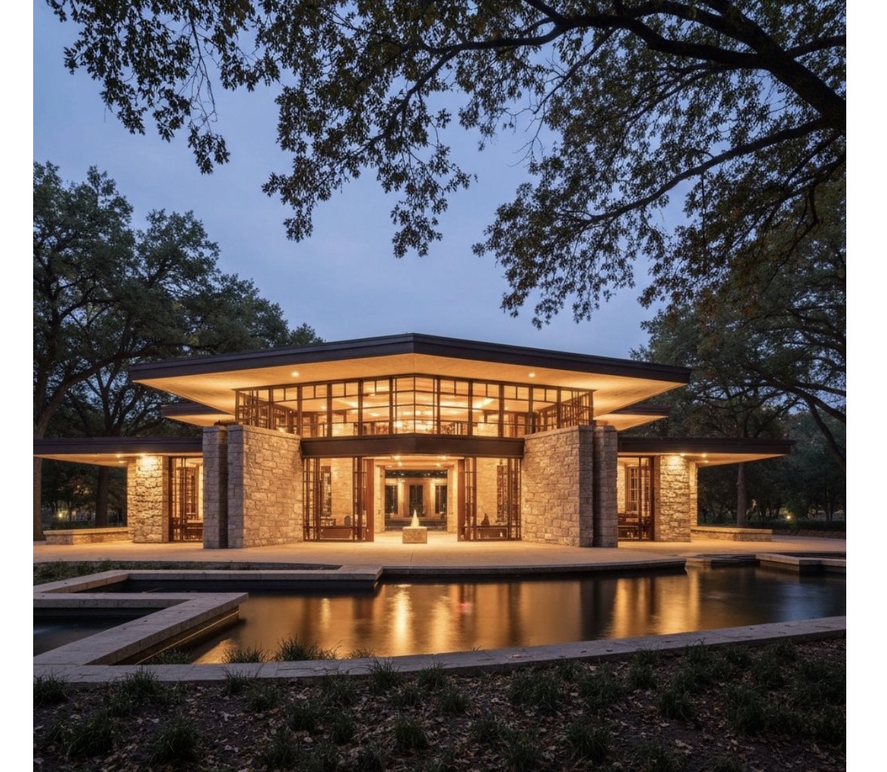 Museum with horizontal cantilevered roofs, natural stone walls, large glass panels, and reflecting pool at dusk